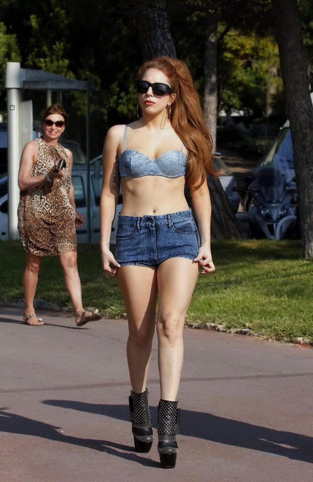 10P Lady Gaga looks hot wearing skimpy bikini top and denim shorts at Les Pirates re