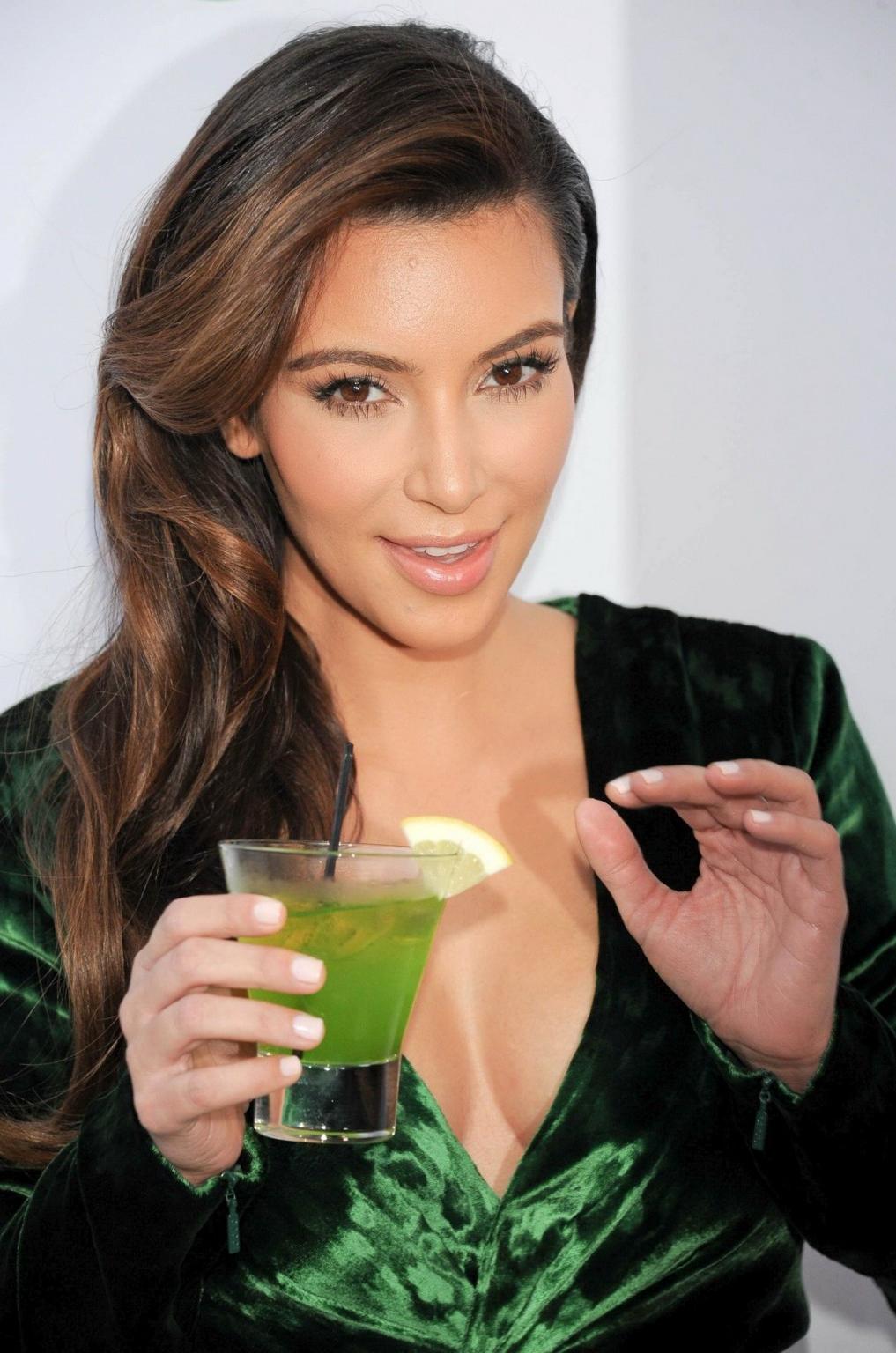 10P Kim Kardashian shows huge cleavage wearing green high slit dress at Midori Makeo