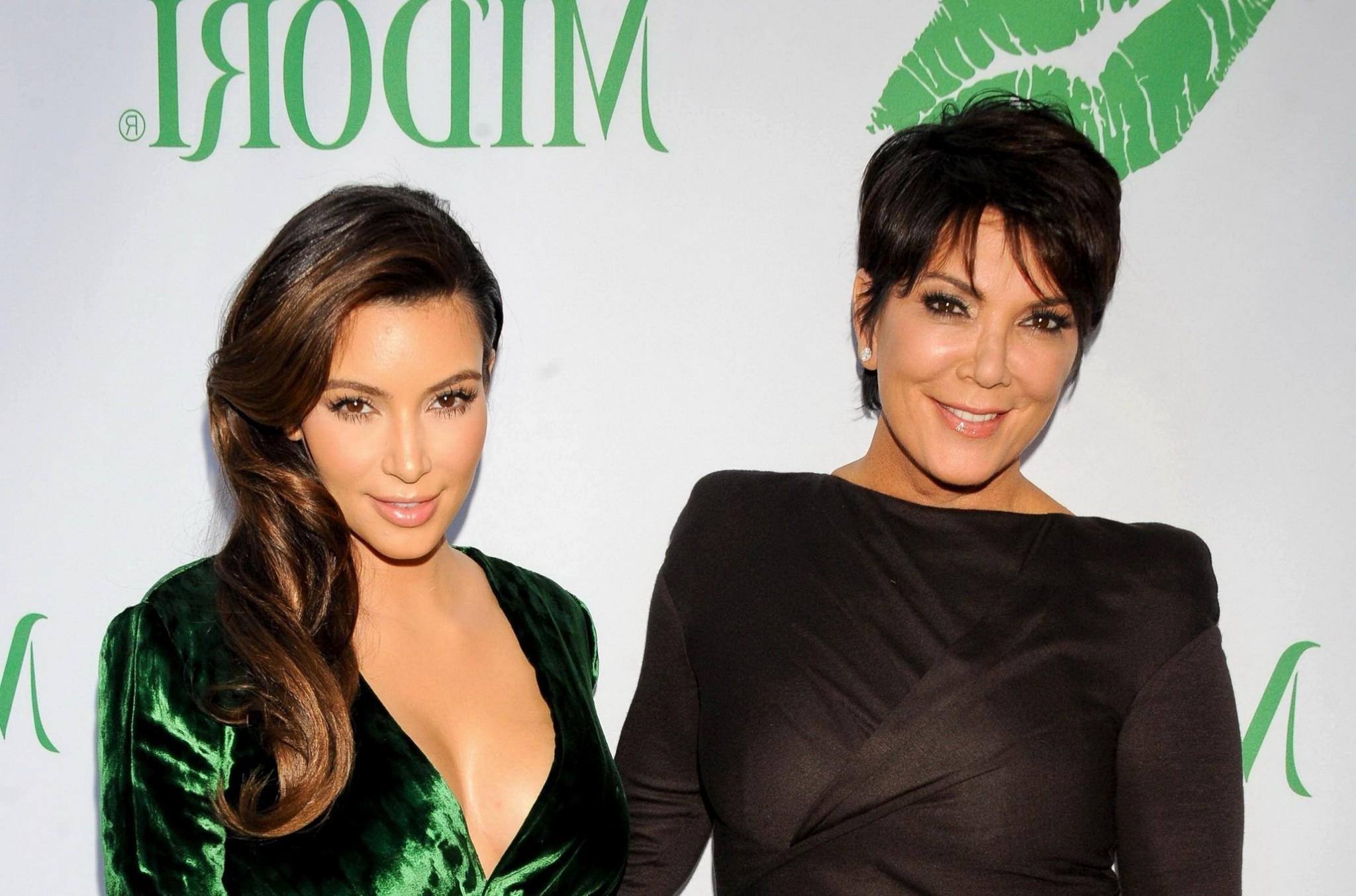 10P Kim Kardashian shows huge cleavage wearing green high slit dress at Midori Makeo