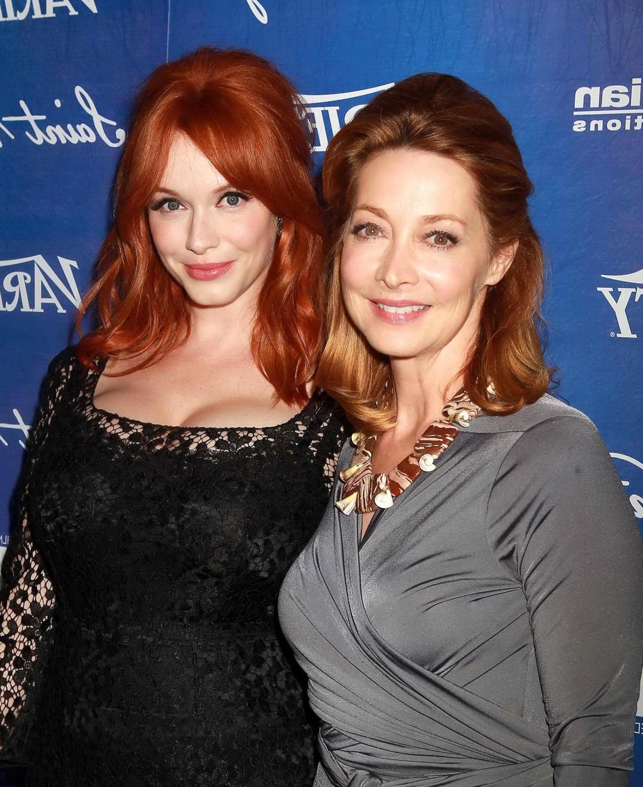 10P Christina Hendricks shows cleavage wearing a black lace dress at Variety Pre-EMM
