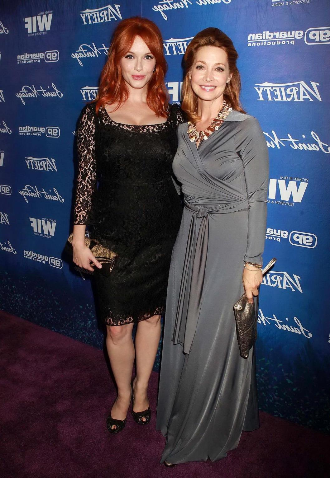 10P Christina Hendricks shows cleavage wearing a black lace dress at Variety Pre-EMM