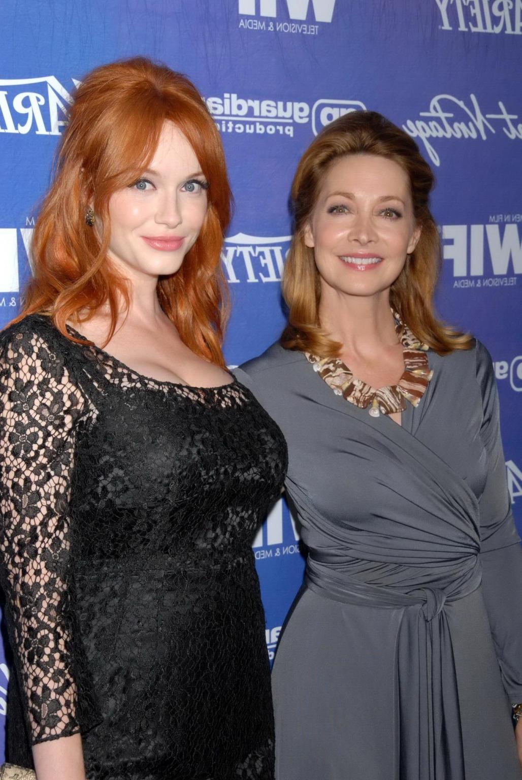 10P Christina Hendricks shows cleavage wearing a black lace dress at Variety Pre-EMM