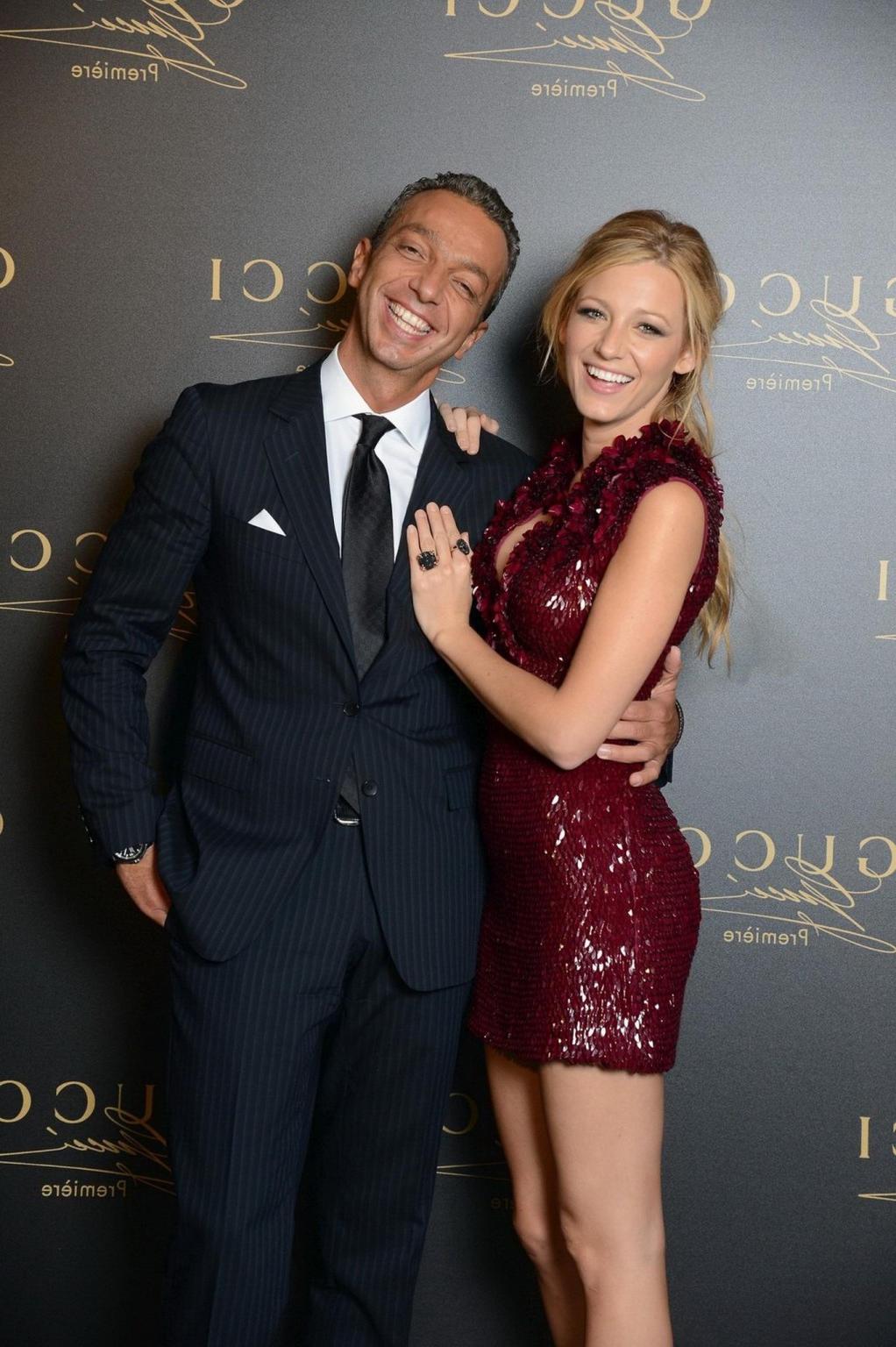 10P Blake Lively leggy and showing big cleavage in a shiny red mini dress at the Guc