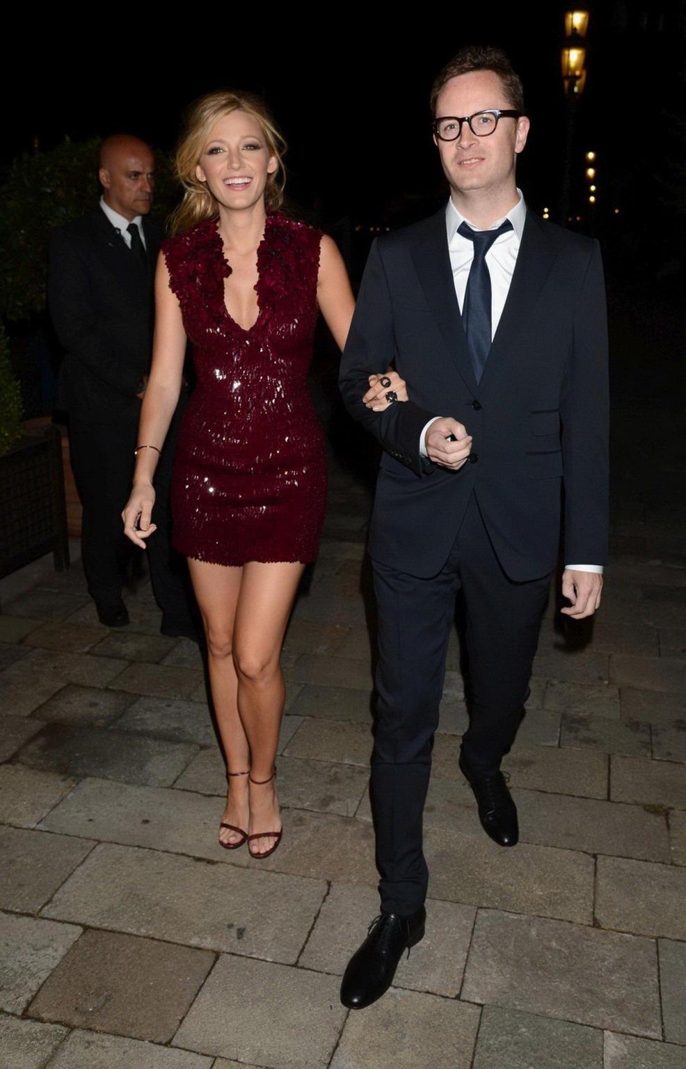 10P Blake Lively leggy and showing big cleavage in a shiny red mini dress at the Guc