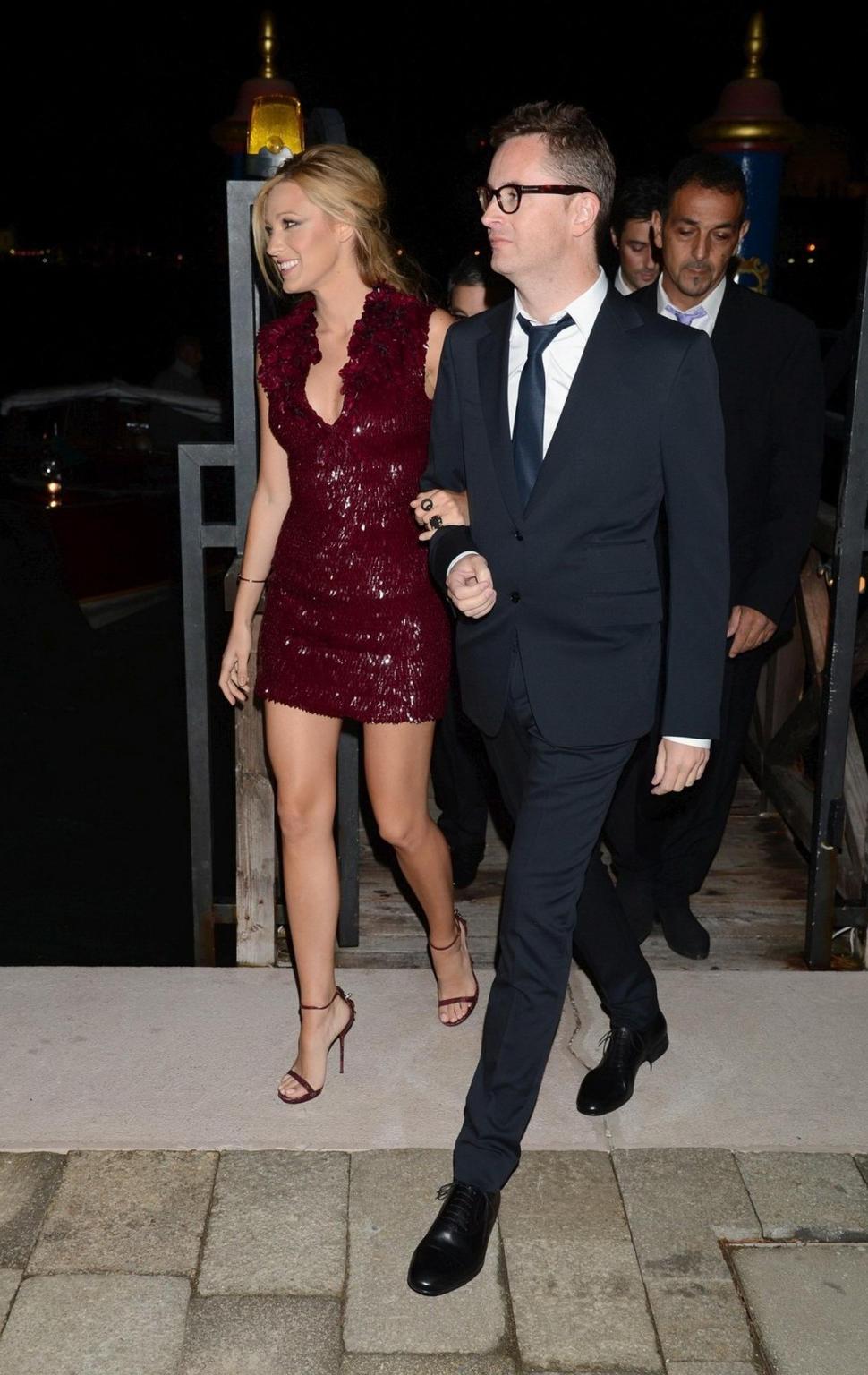 10P Blake Lively leggy and showing big cleavage in a shiny red mini dress at the Guc