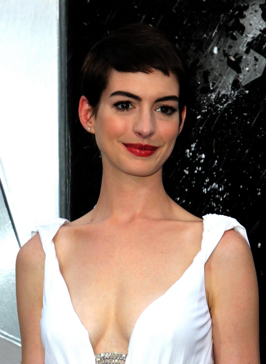 10P Anne Hathaway showing cleavage in white dress at 'Dark Knight Rises' premiere in