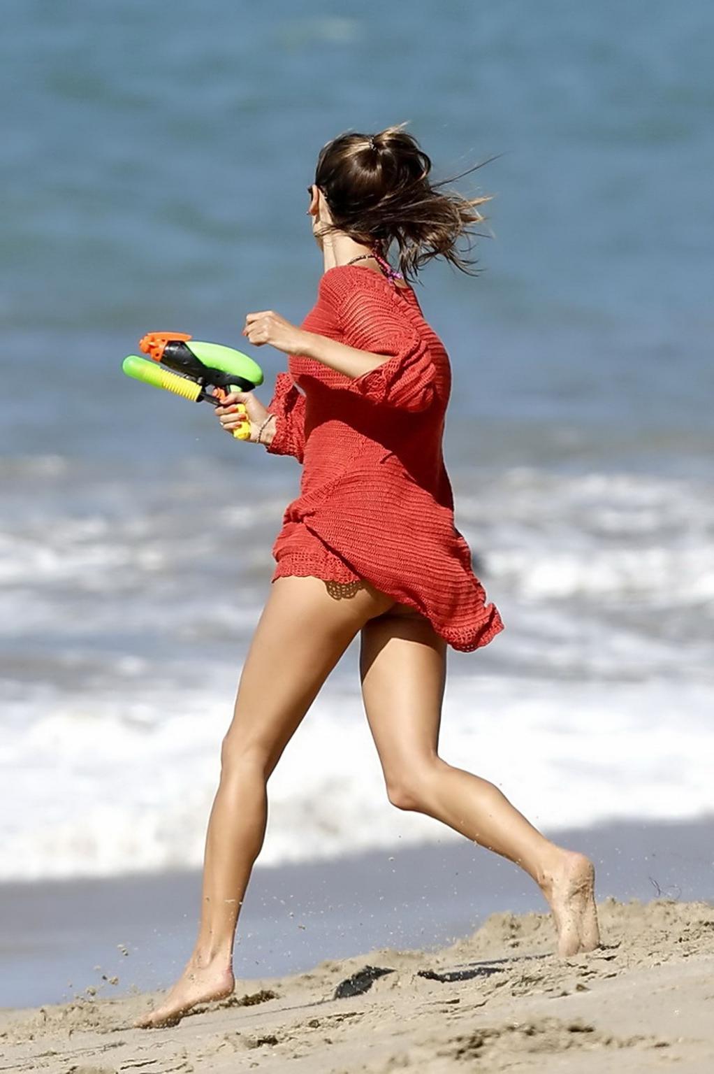 10P Alessandra Ambrosio showing off her hot ass wearing bikini bottom at the beach i