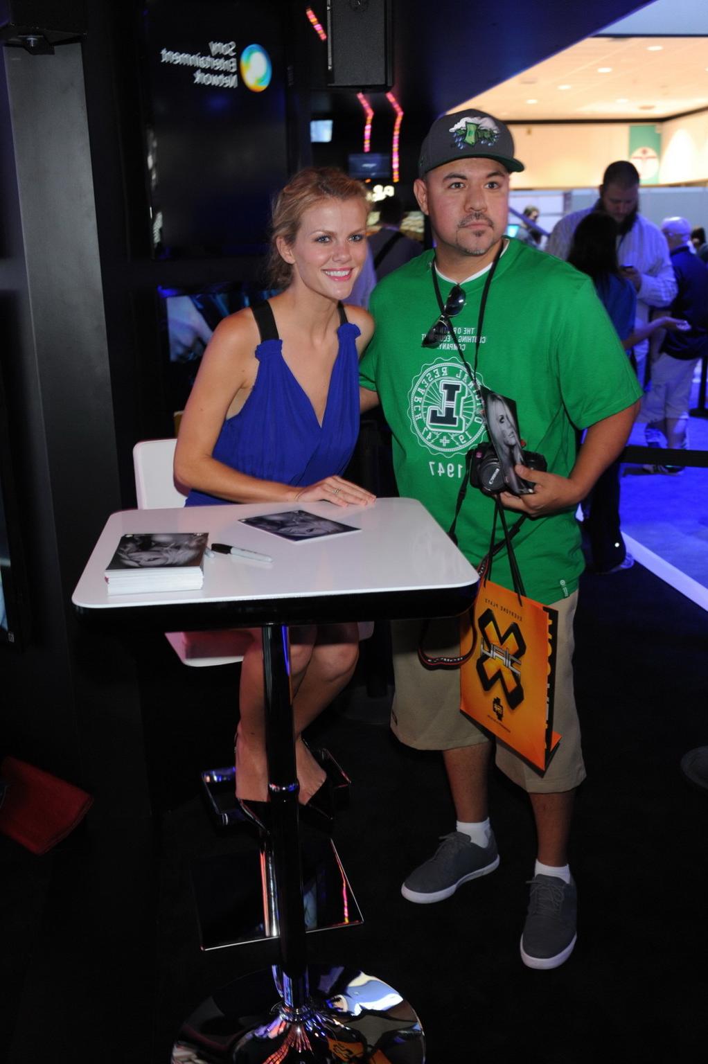 10P Brooklyn Decker showing big cleavage in blue mini dress at PlayStation booth at 