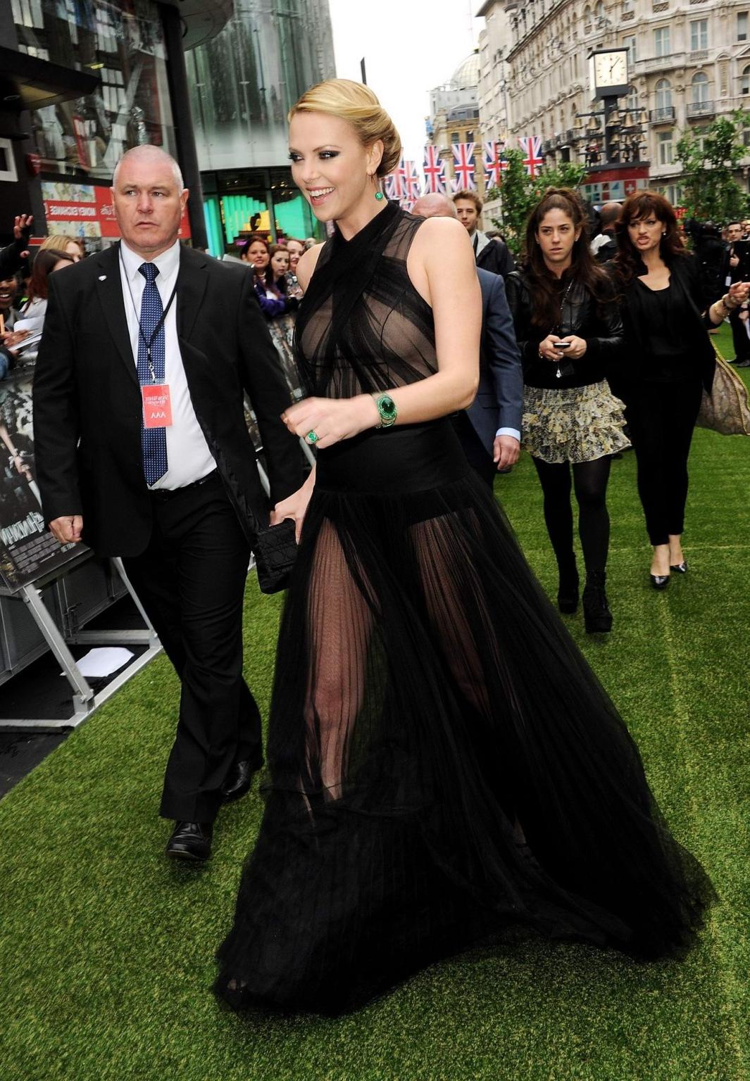 10P Charlize Theron shows her panties wearing a black lace dress at 'Snow White and 