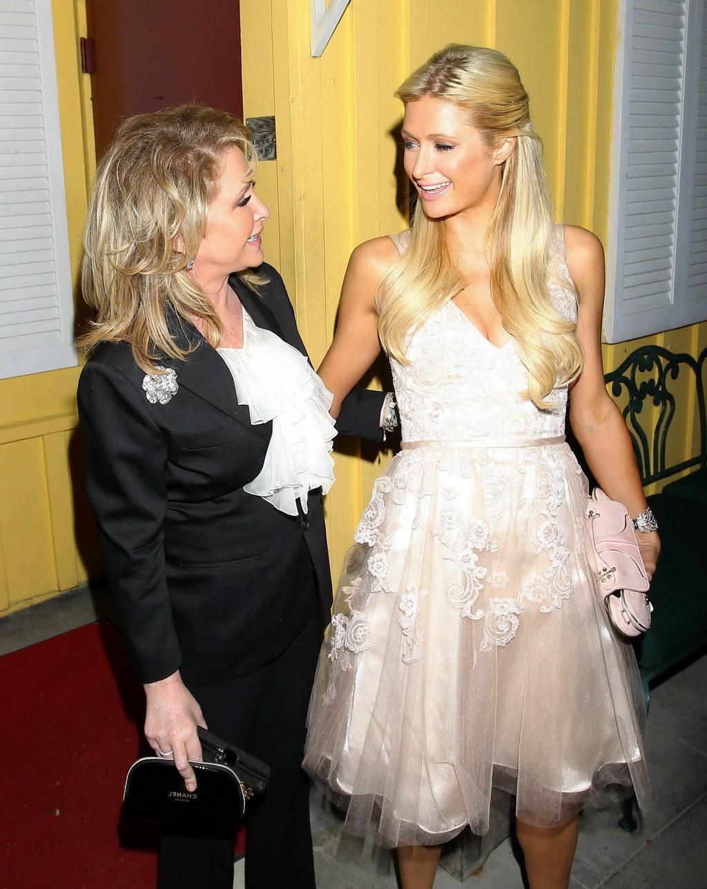 16P Paris Hilton showing big cleavage in cute white dress leaving restaurant in LA