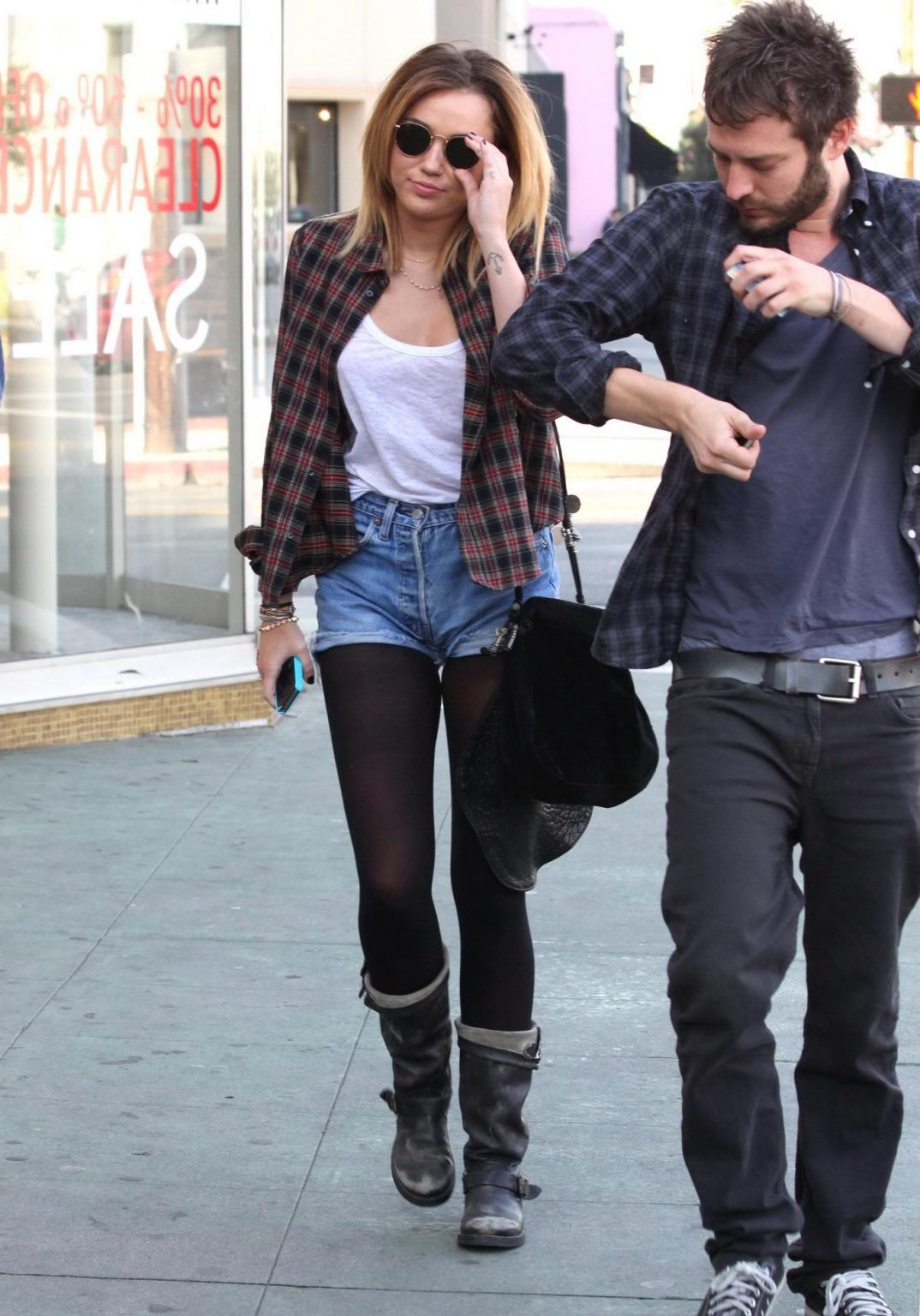 16P Miley Cyrus braless showing pokies outside Wokcano Restaurant in LA