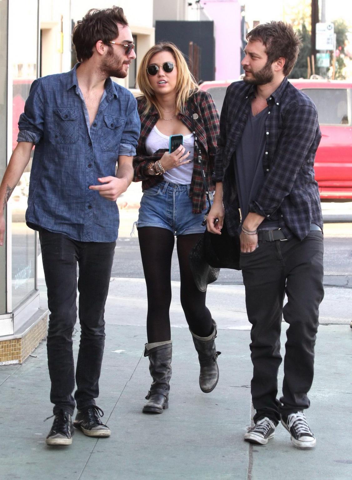 16P Miley Cyrus braless showing pokies outside Wokcano Restaurant in LA