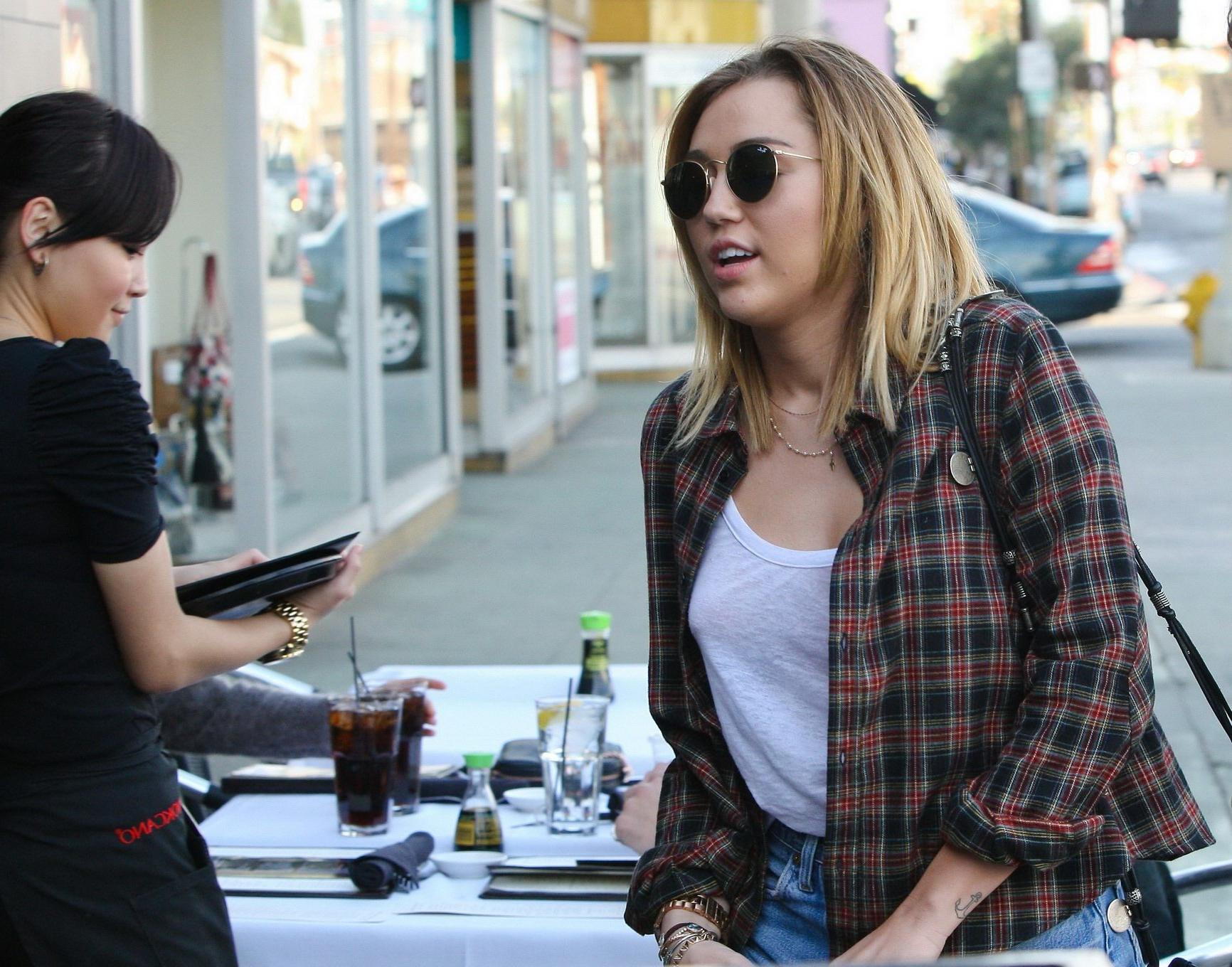 16P Miley Cyrus braless showing pokies outside Wokcano Restaurant in LA