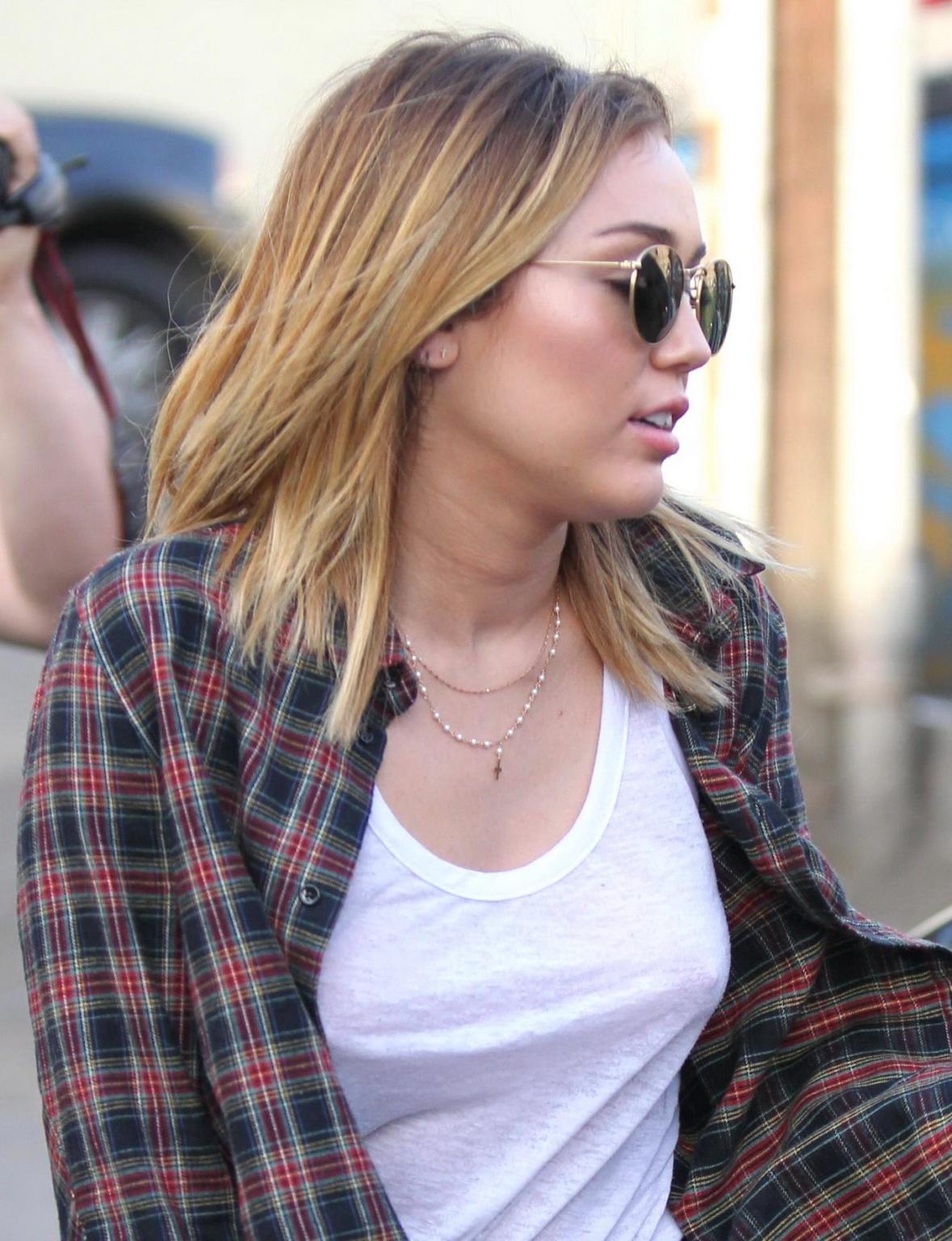 16P Miley Cyrus braless showing pokies outside Wokcano Restaurant in LA