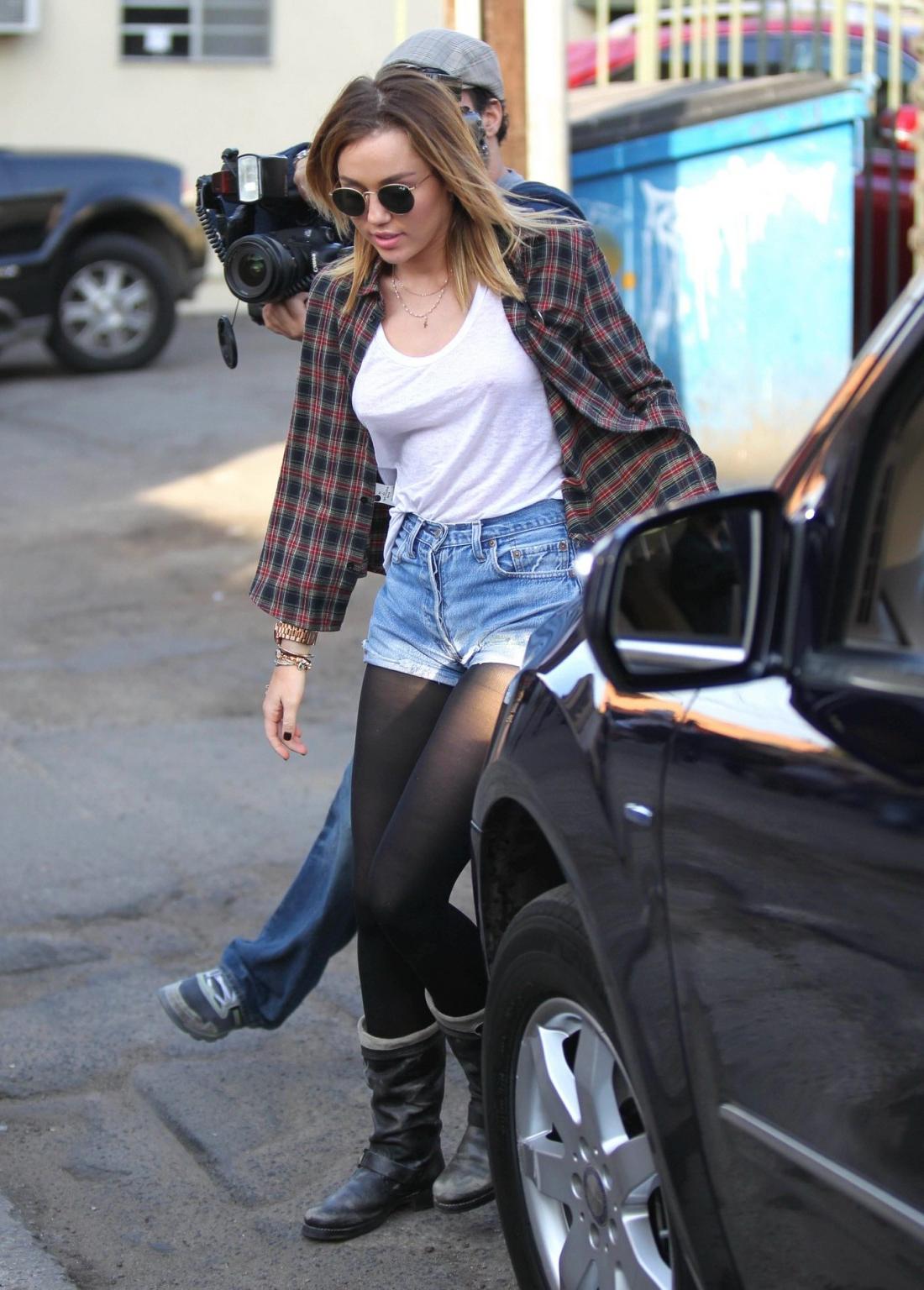 16P Miley Cyrus braless showing pokies outside Wokcano Restaurant in LA
