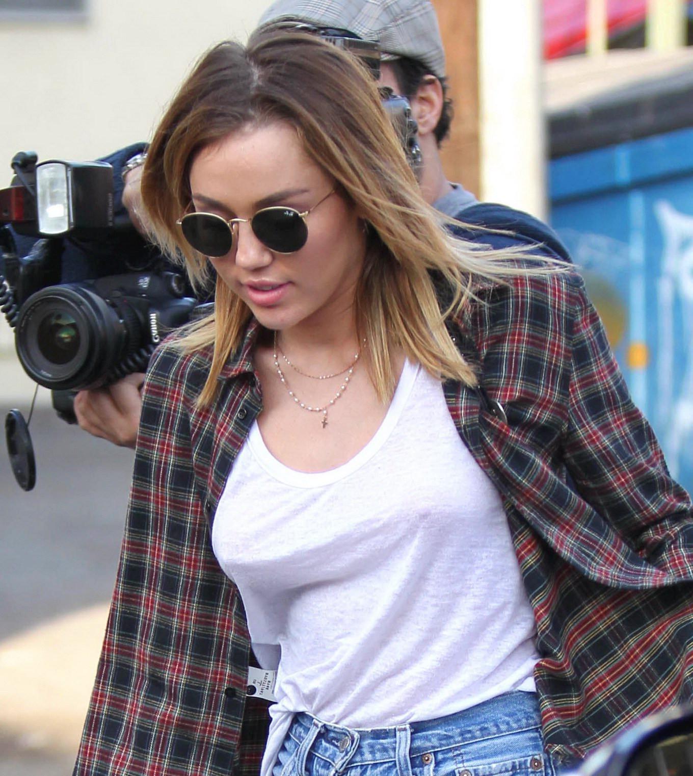 16P Miley Cyrus braless showing pokies outside Wokcano Restaurant in LA