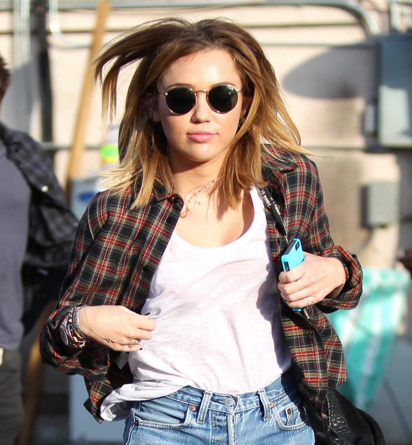 16P Miley Cyrus braless showing pokies outside Wokcano Restaurant in LA