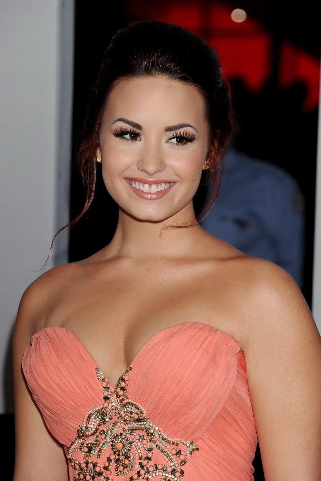 16P Demi Lovato shows cleavage wearing strapless dress at 2012 People's Choice Award