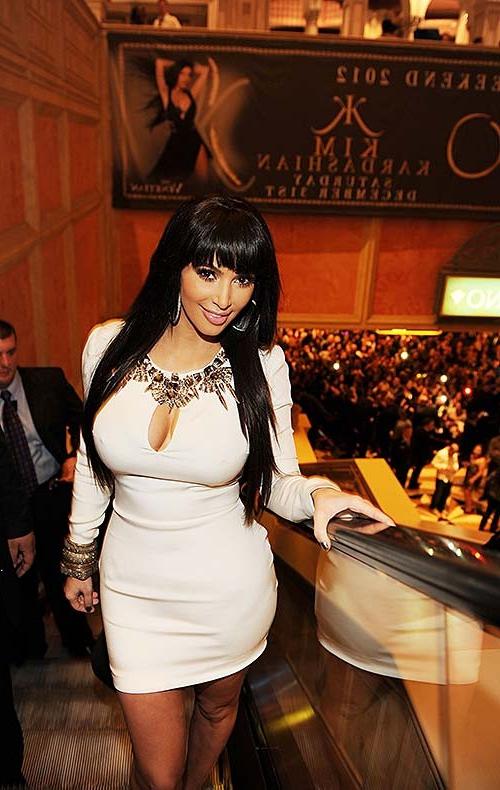 16P Kim Kardashian exposing sexy body and massive cleavage
