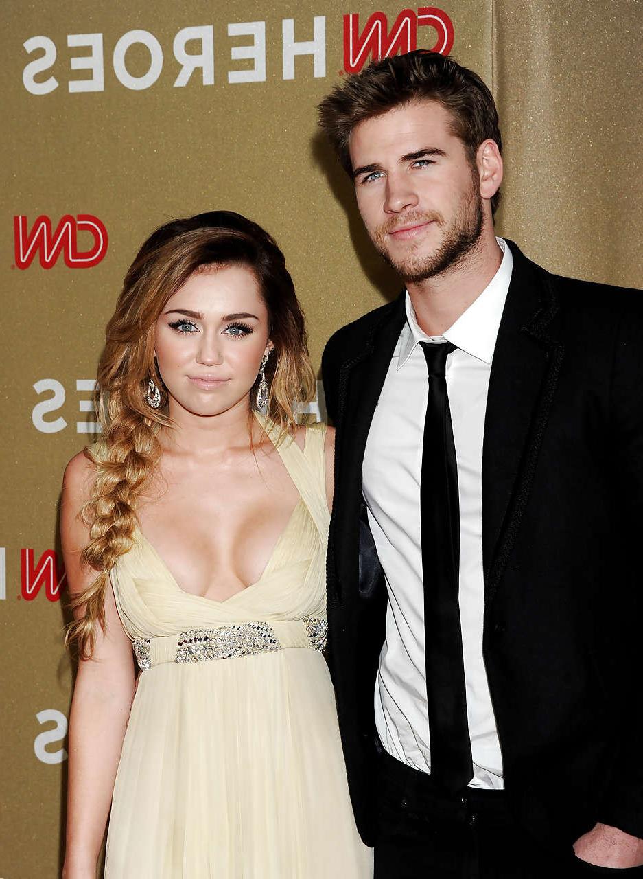16P Miley Cyrus showing huge cleavage in long silk dress paparazzi pictures