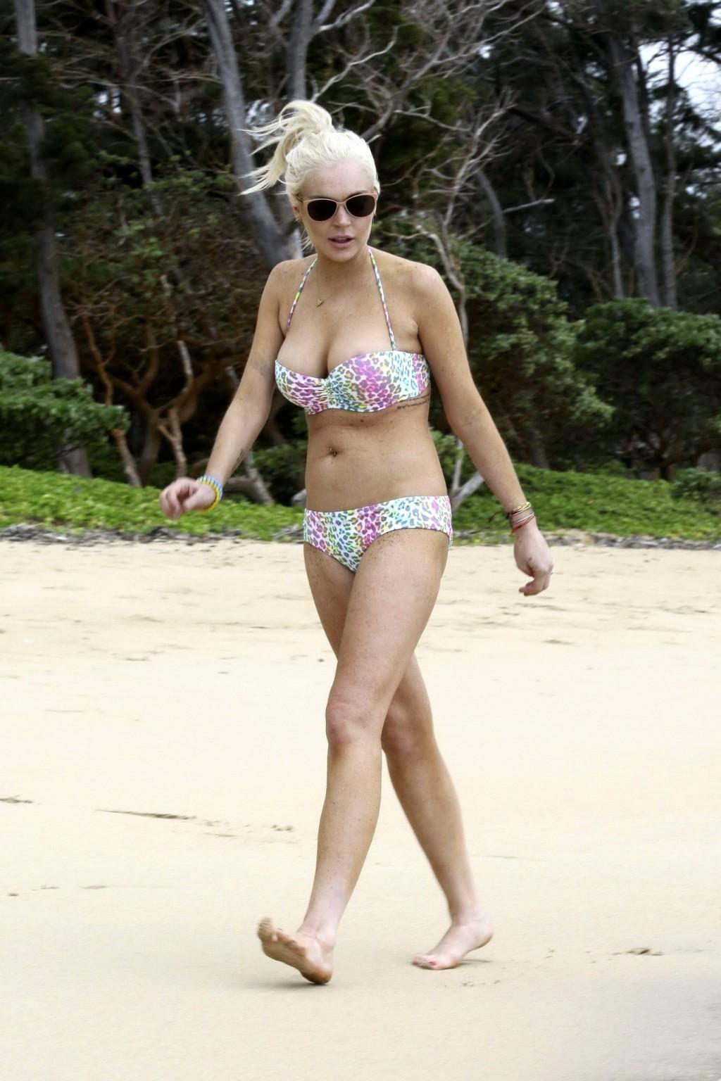 16P Lindsay Lohan bikini nip slip on a beach in Hawaii