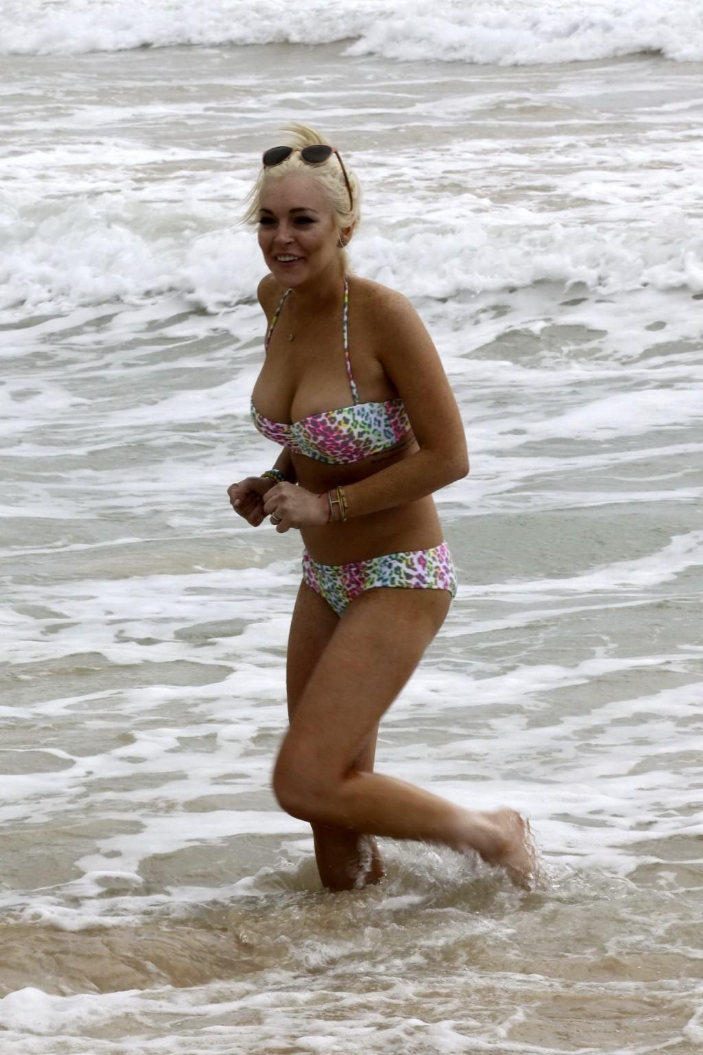 16P Lindsay Lohan bikini nip slip on a beach in Hawaii