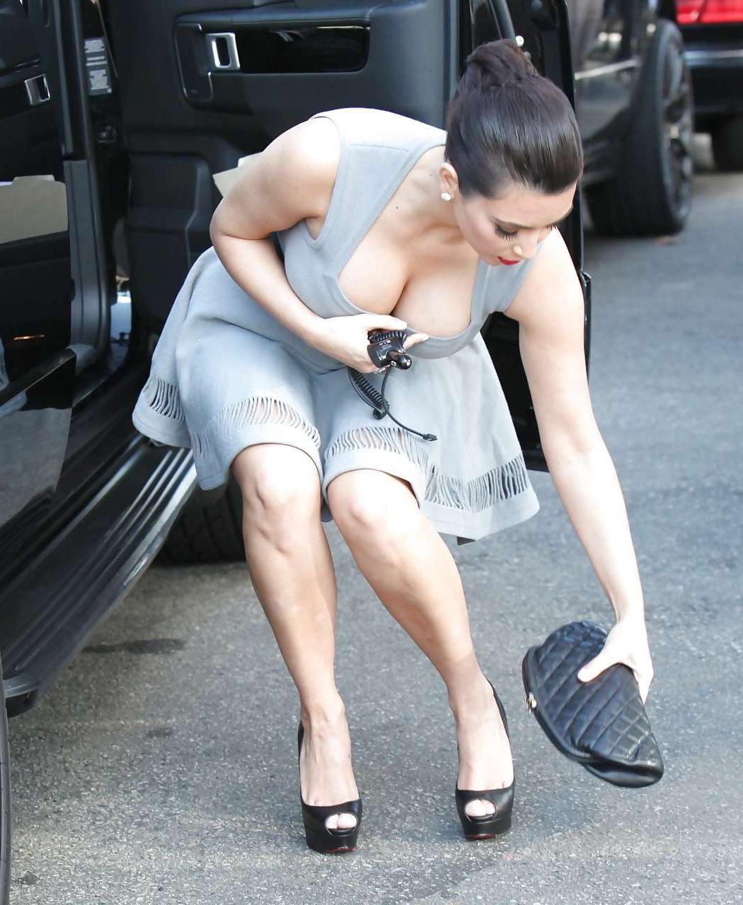 11P Kim Kardashian showing huge cleavage on street and leggy in mini skirt