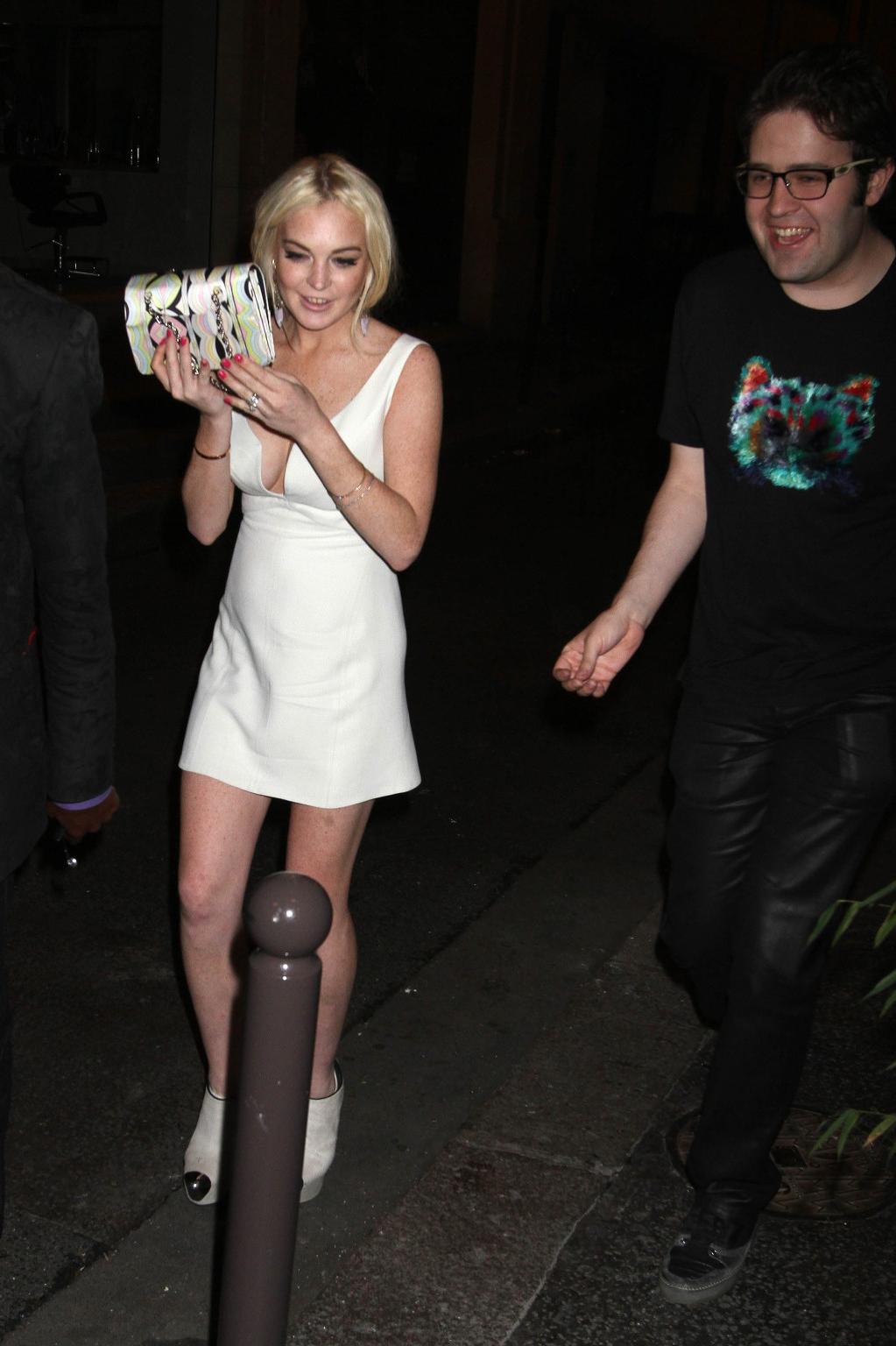 16P Lindsay Lohan shows cleavage  panties leaving a club in Paris