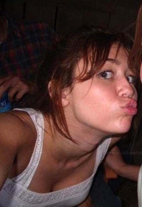 16P Miley Cyrus lying on the bed and exposing her sexy body in underwear