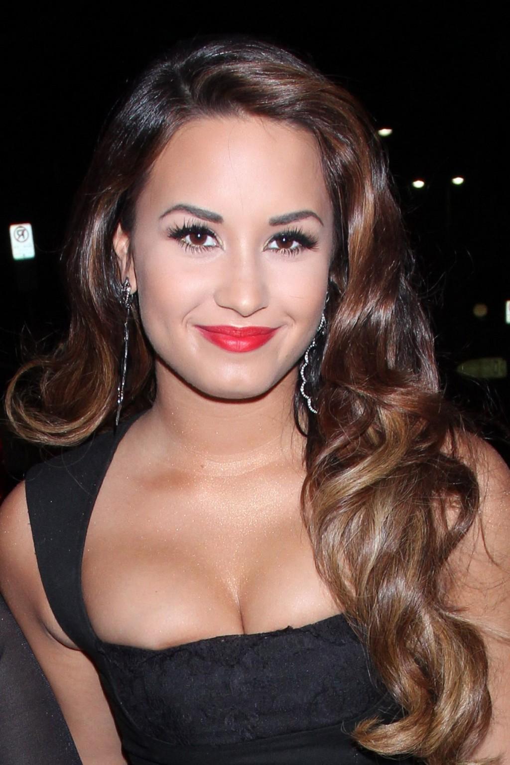 16P Demi Lovato shows huge cleavage in low cut black dress heading to MTV's VMA Pre 