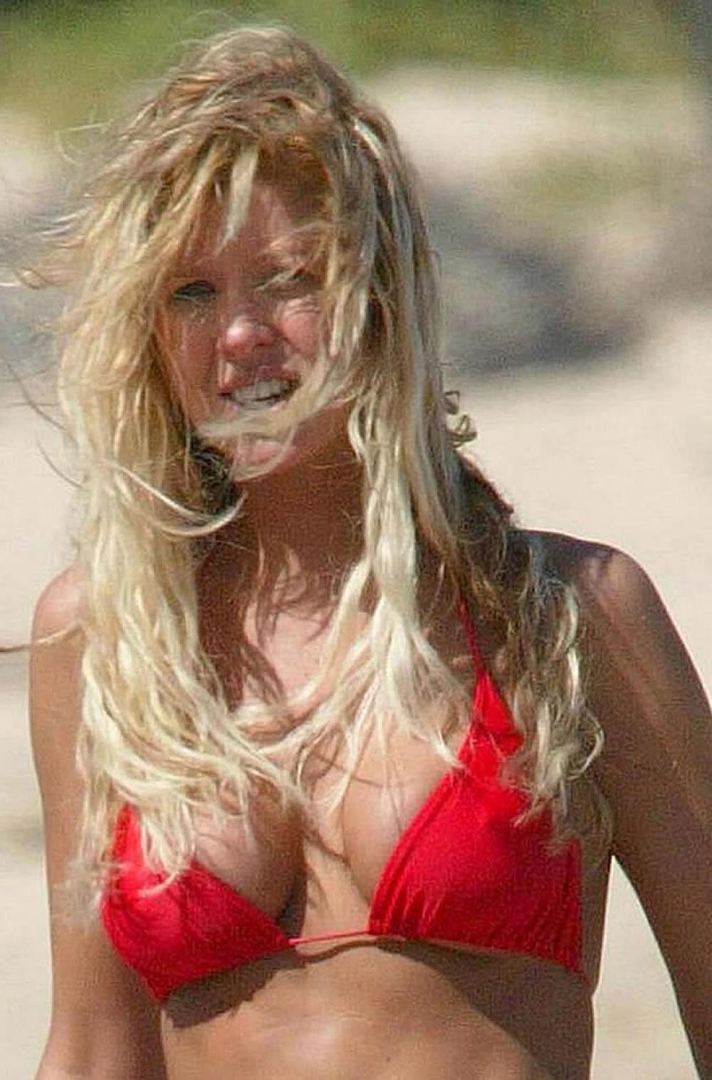 15P Tara Reid nice cleavage in decent black dress
