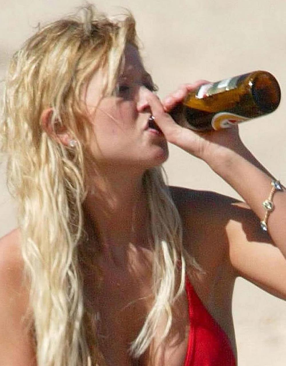 15P Tara Reid nice cleavage in decent black dress