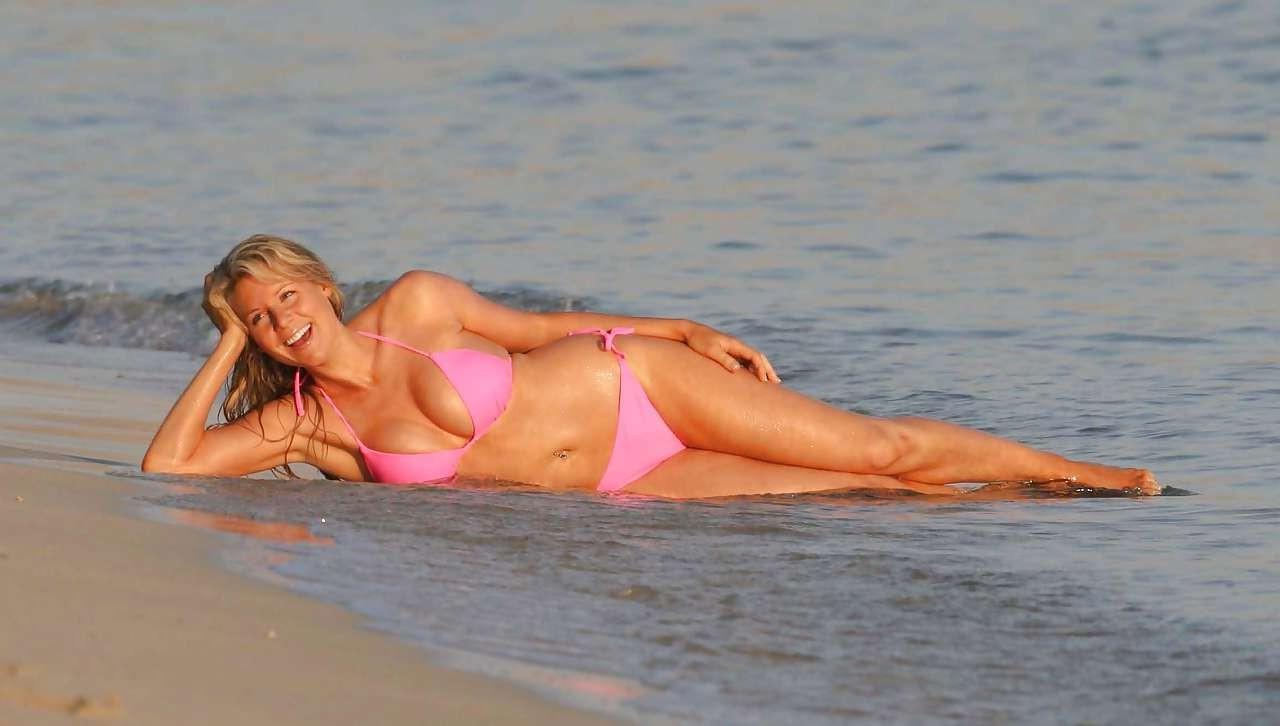 16P Abi Titmuss looking sexy in red bikini on beach and show big cleavage