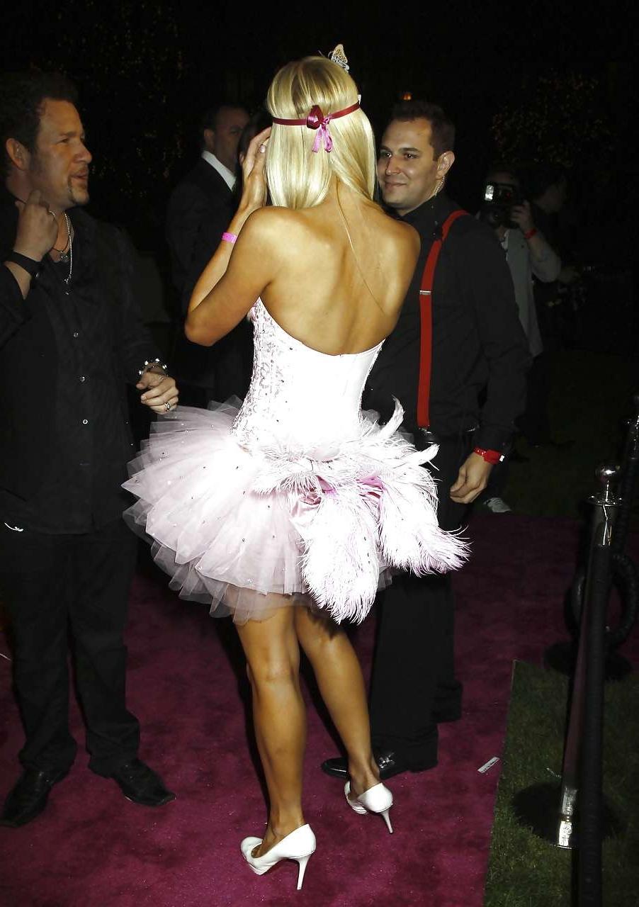 16P Paris Hilton leggy and big cleavage in mini dress paparazzi pictures