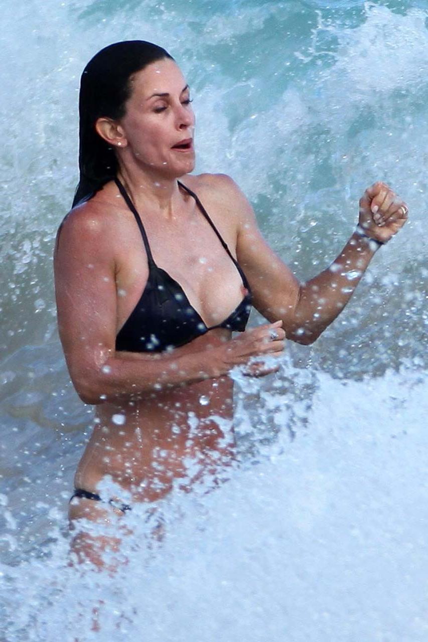 16P Courteney Cox looking sexy in various bikini and nipple slip on beach paparazzi 