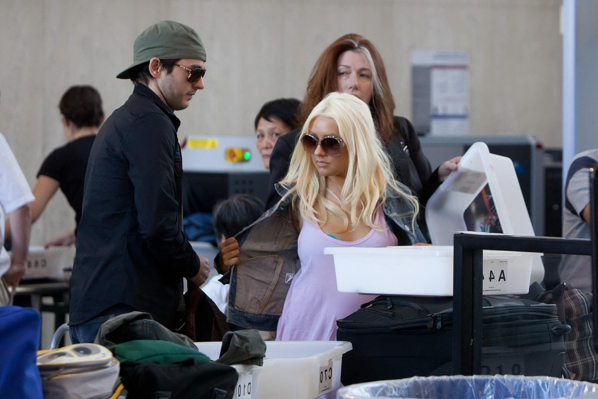 16P Christina Aguilera shows huge cleavage departing from LAX Airport