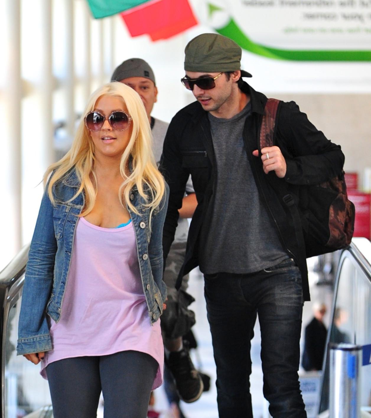 16P Christina Aguilera shows huge cleavage departing from LAX Airport