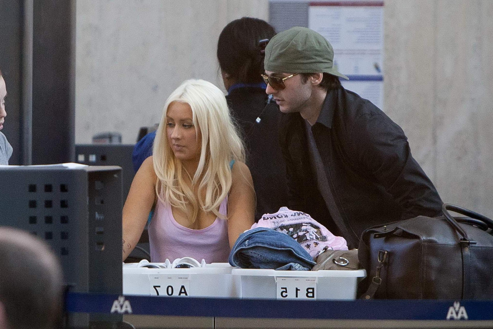 16P Christina Aguilera shows huge cleavage departing from LAX Airport