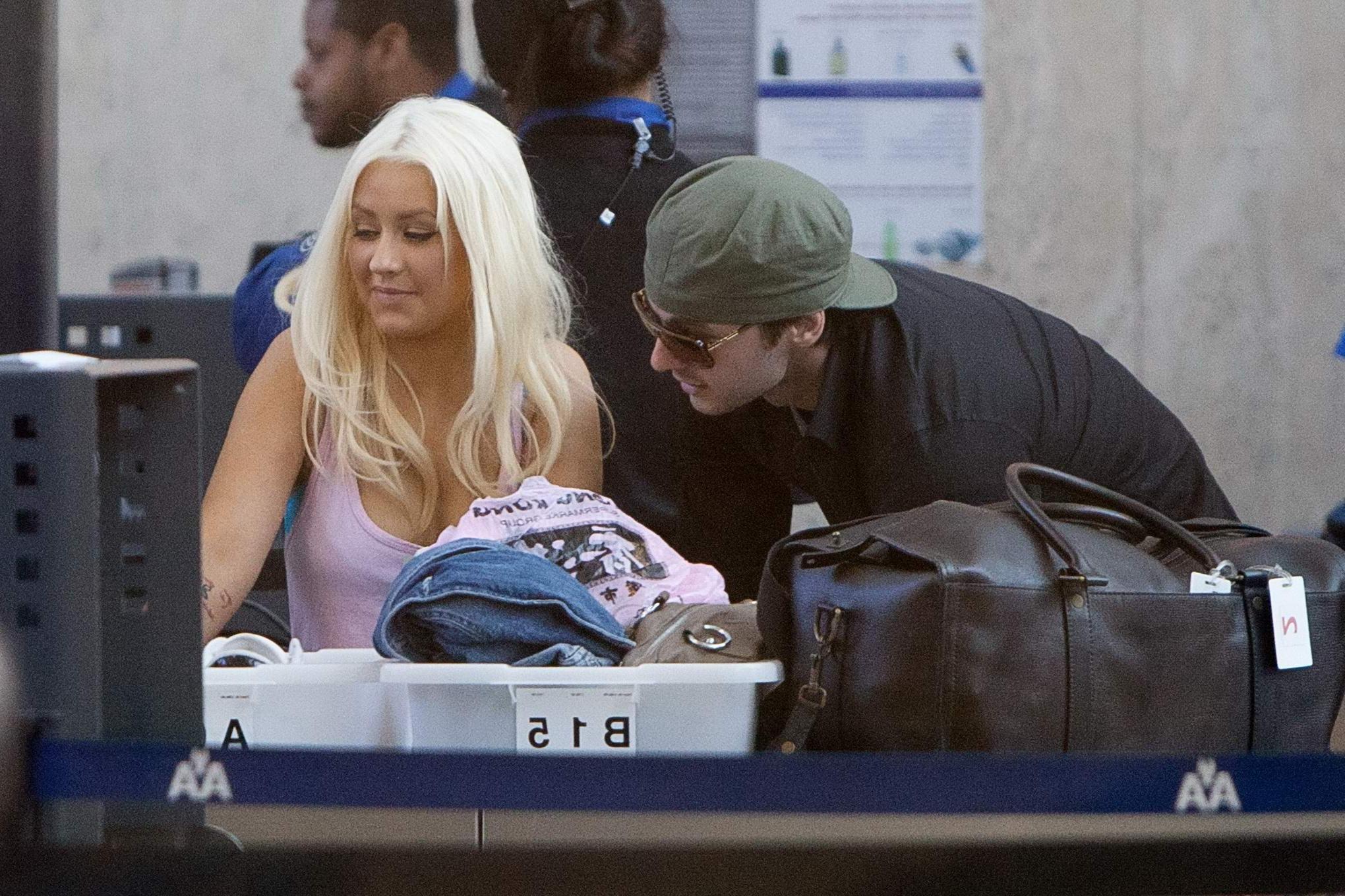 16P Christina Aguilera shows huge cleavage departing from LAX Airport