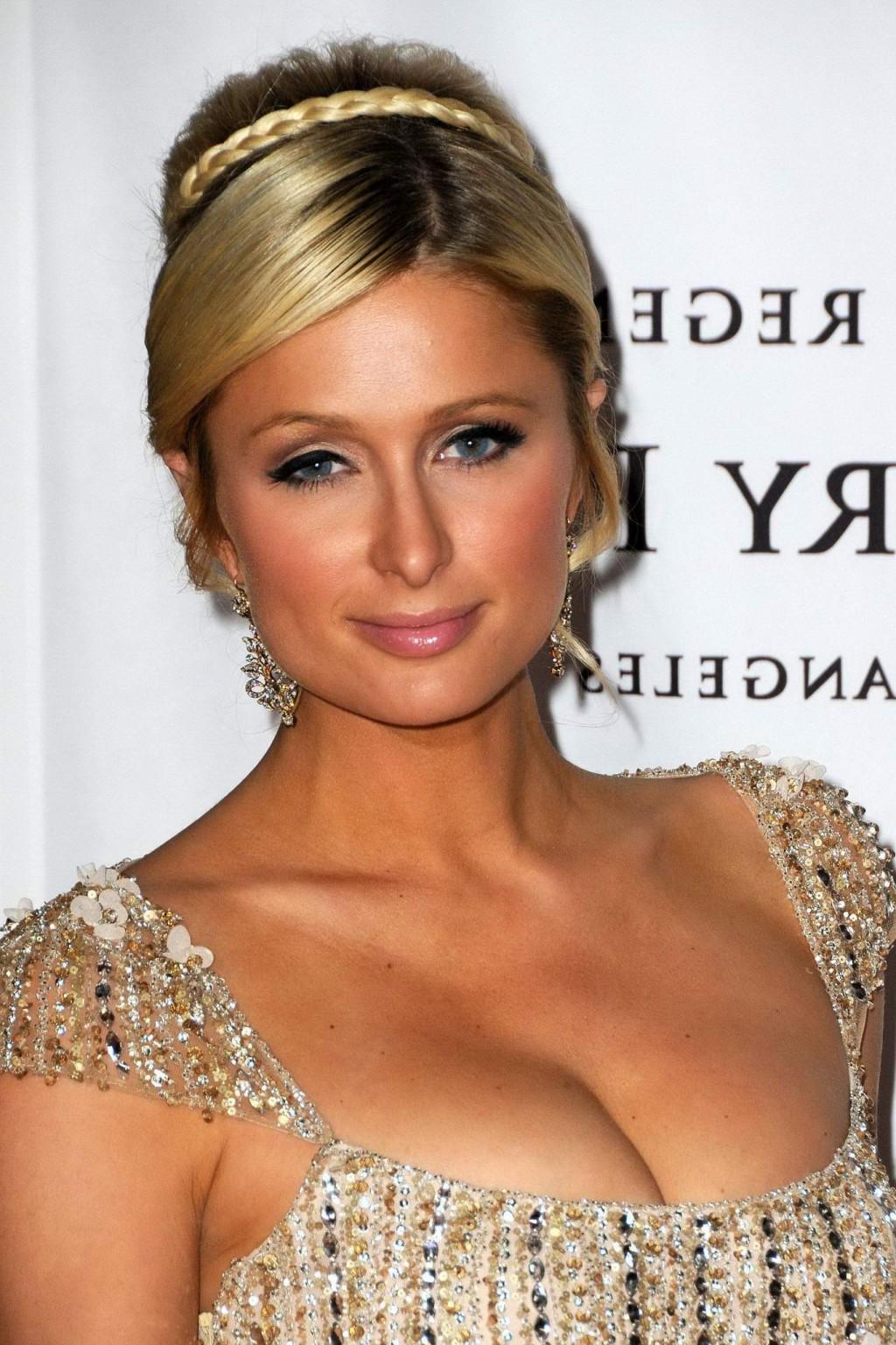 16P Paris Hilton shows cleavage wearing low cut dress at Race to Erase MS Gala in LA