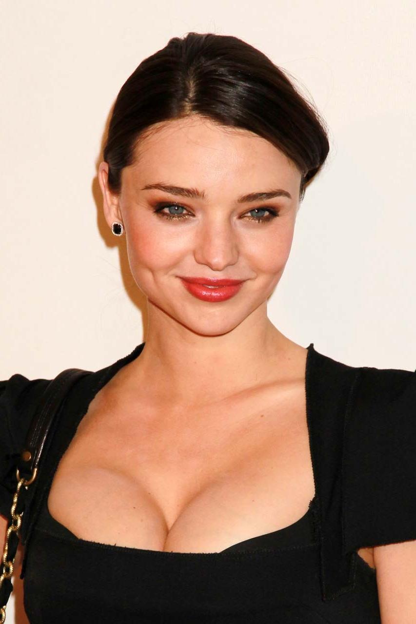 16P Miranda Kerr posing in sexy black dress and exposing huge cleavage