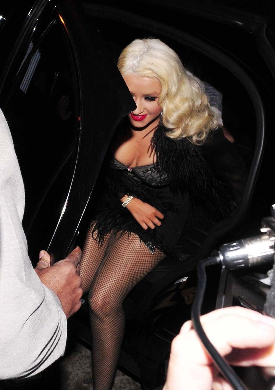 16P Christina Aguilera exposing her huge cleavage and lots of legs while exit from c