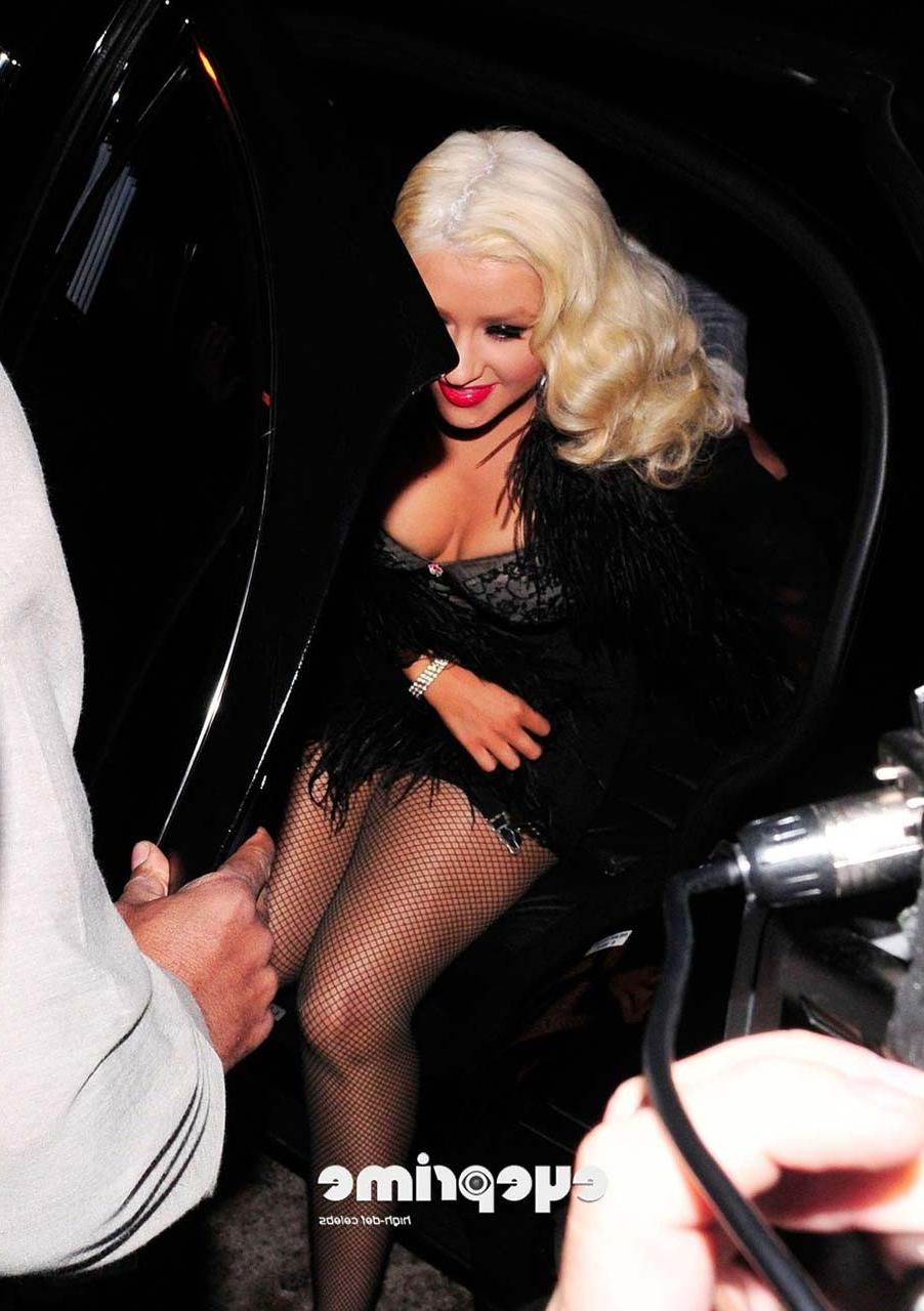 16P Christina Aguilera exposing her huge cleavage and lots of legs while exit from c