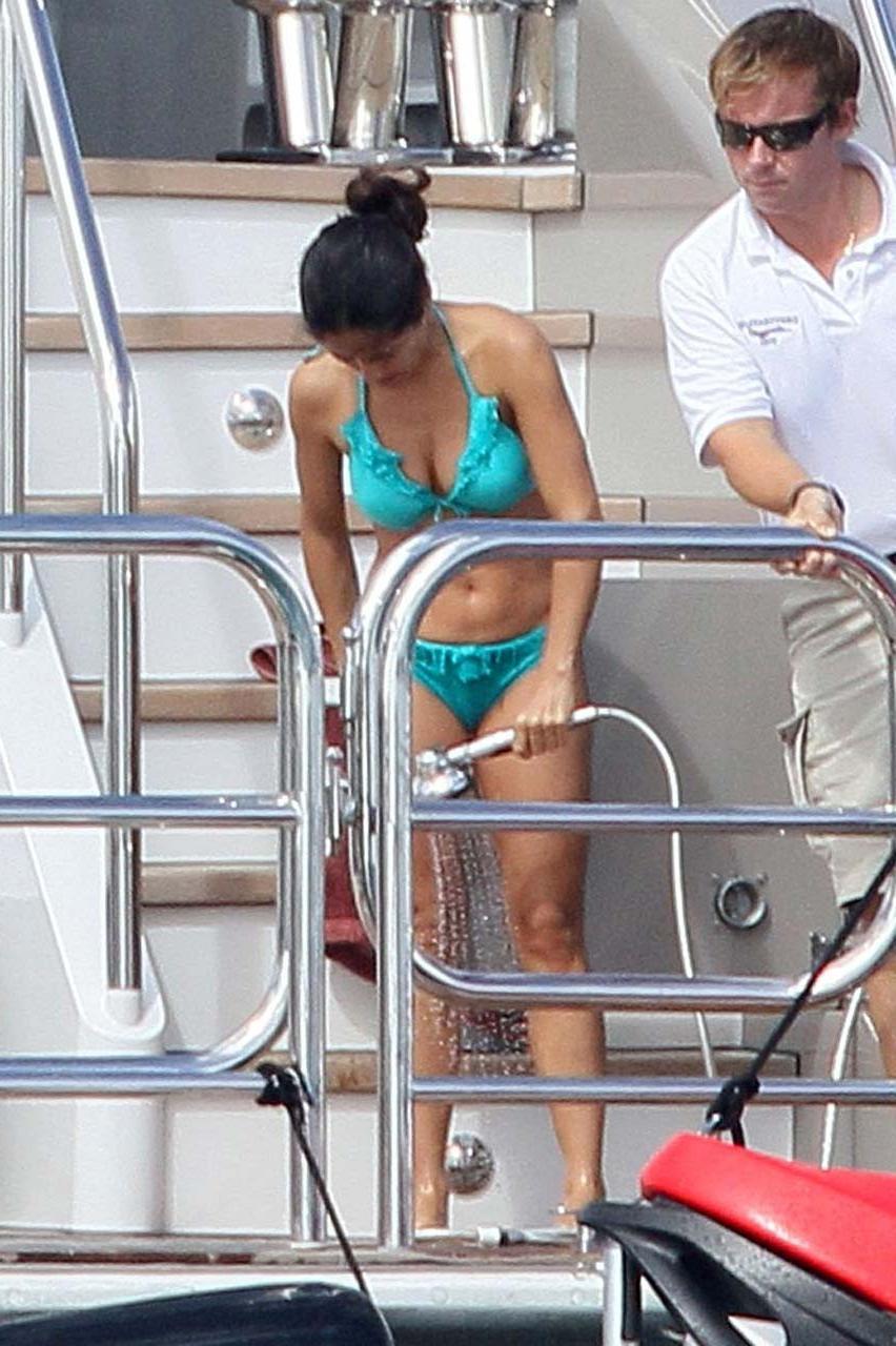 16P Salma Hayek showing huge cleavage and looking sexy in bikini paparazzi pictures