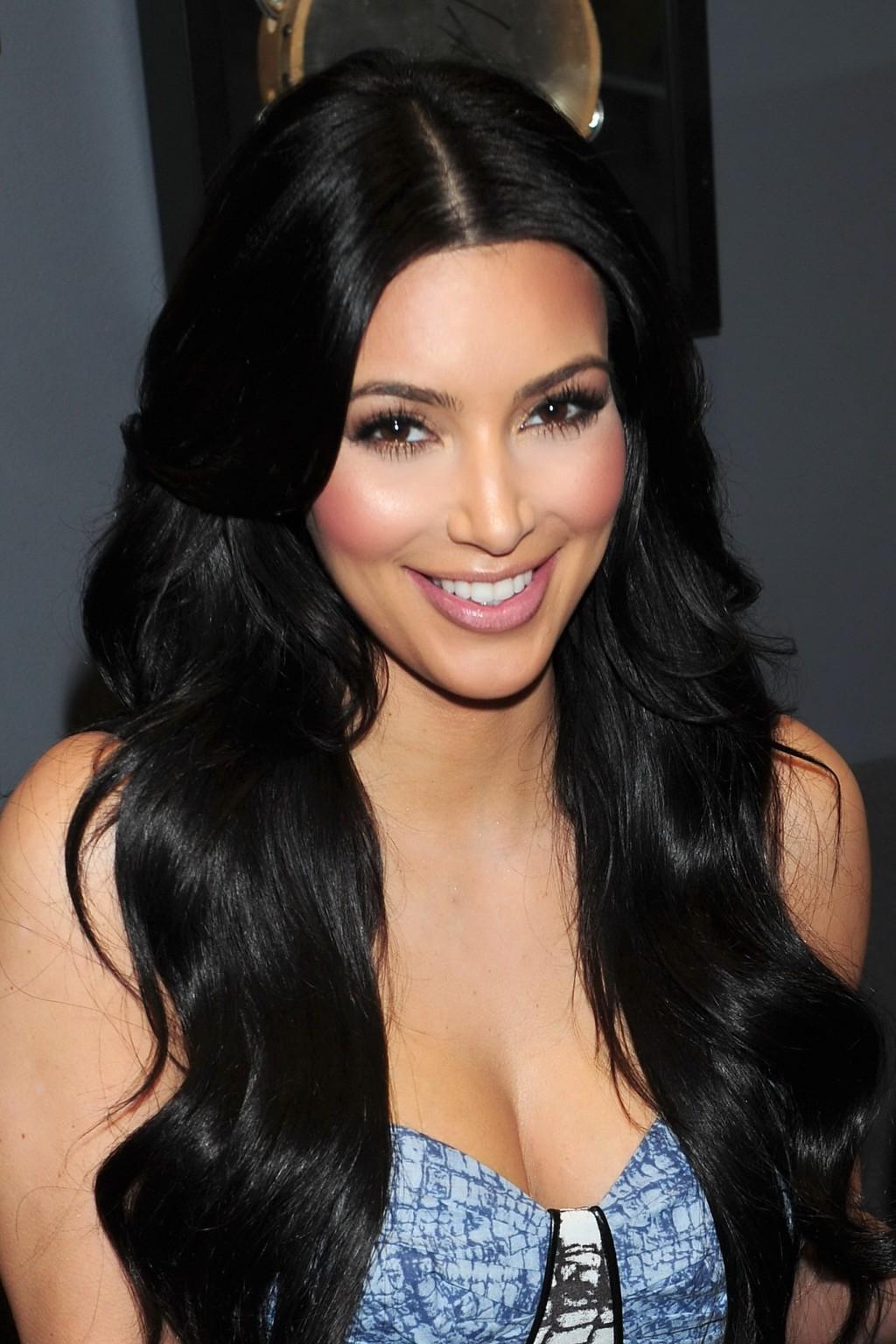 16P Kim Kardashian shows cleavage while guesting at SiriusXM Radio