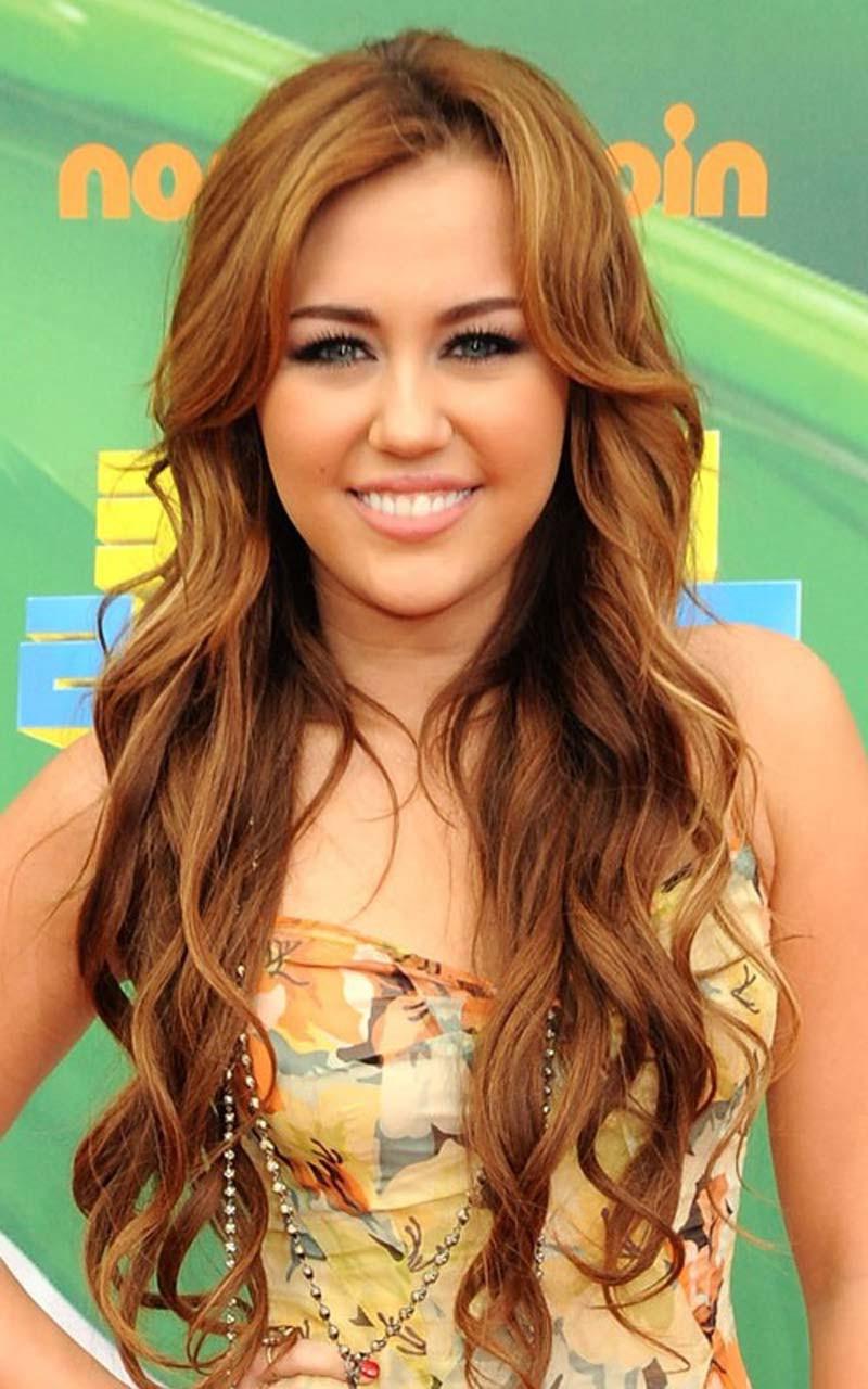 16P Miley Cyrus big cleavage in underwear and looking sexy in colorfull dress