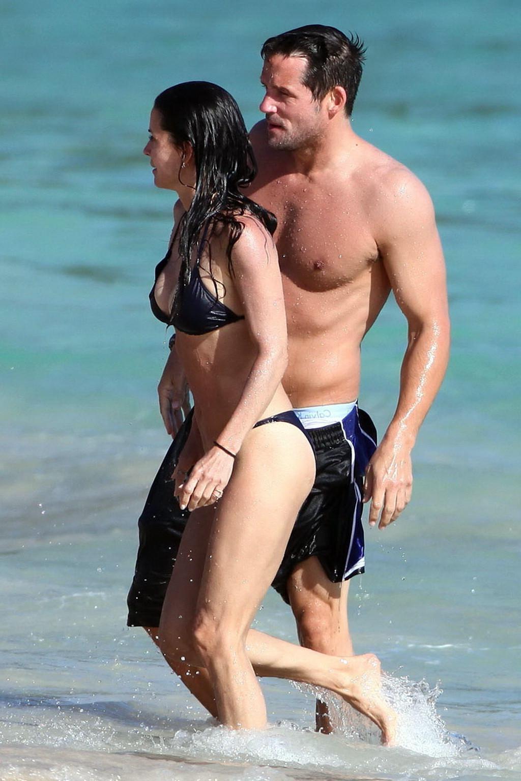 16P Courteney Cox bikini nip slip on the beach in St. Barts