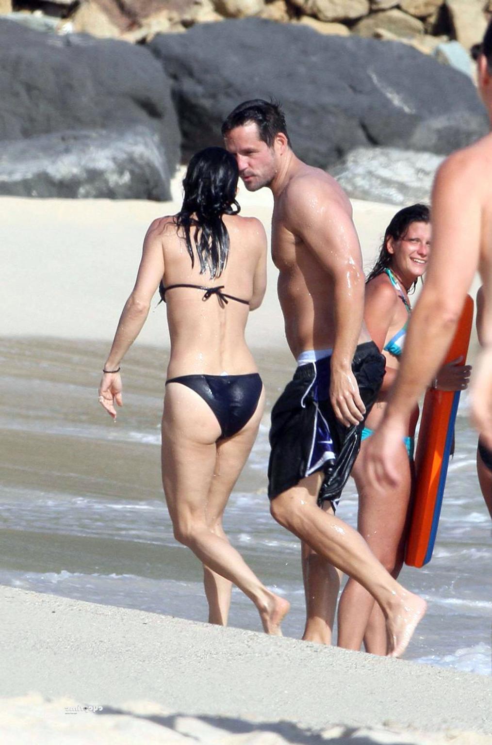 16P Courteney Cox bikini nip slip on the beach in St. Barts