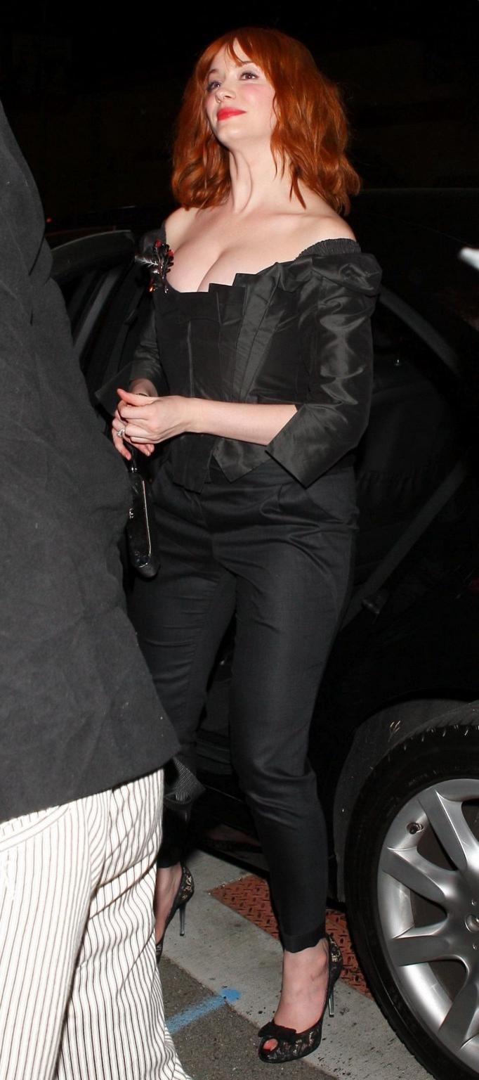 16P Christina Hendricks showing huge cleavage at Vivienne Westwood LA store opening