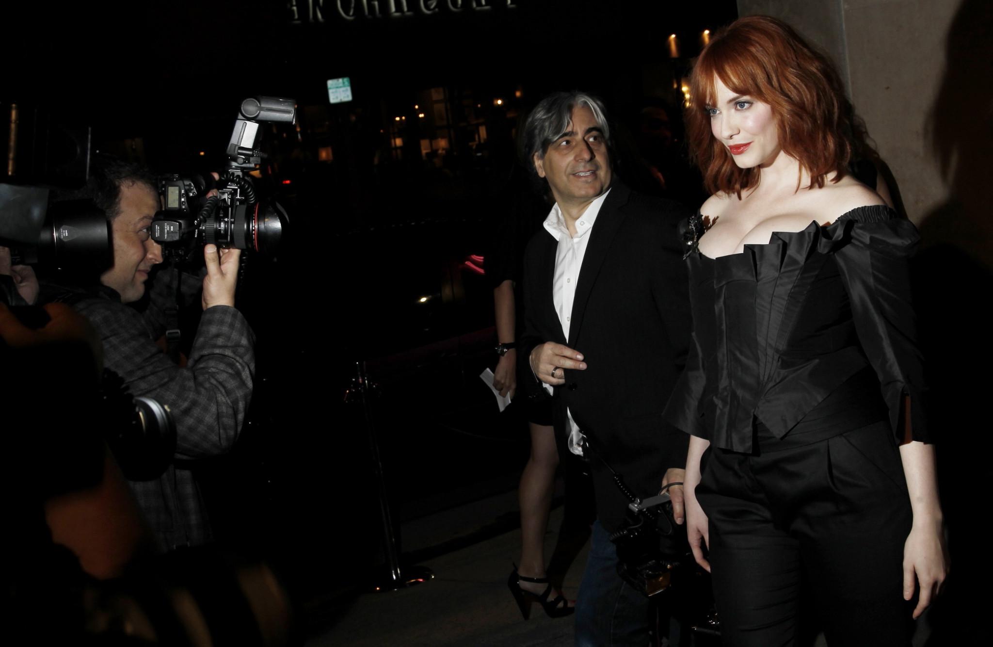 16P Christina Hendricks showing huge cleavage at Vivienne Westwood LA store opening